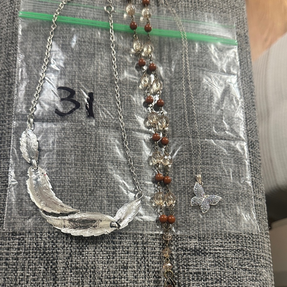 Silver Feather Necklace & 2 more. Bag #31. Bundle for better pricing.